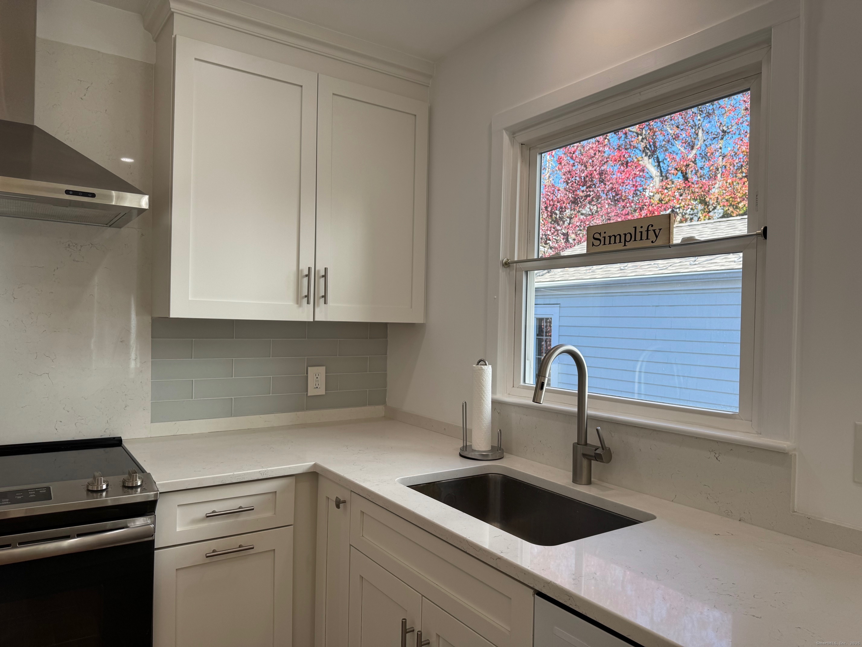 15 Sunwich Road Norwalk, CT 06853 - Photo 12 of 33 a kitchen with a sink cabinets and appliances