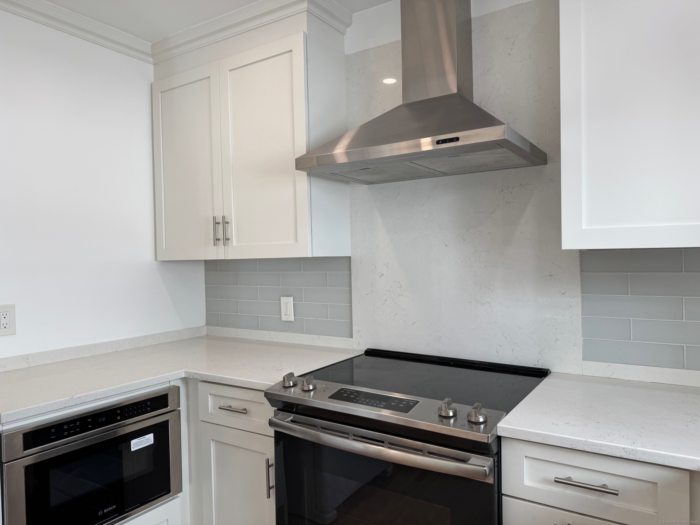 15 Sunwich Road Norwalk, CT 06853 - Photo 13 of 33 a kitchen with granite countertop a stove and a sink