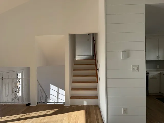 a view of entryway with wooden floor
