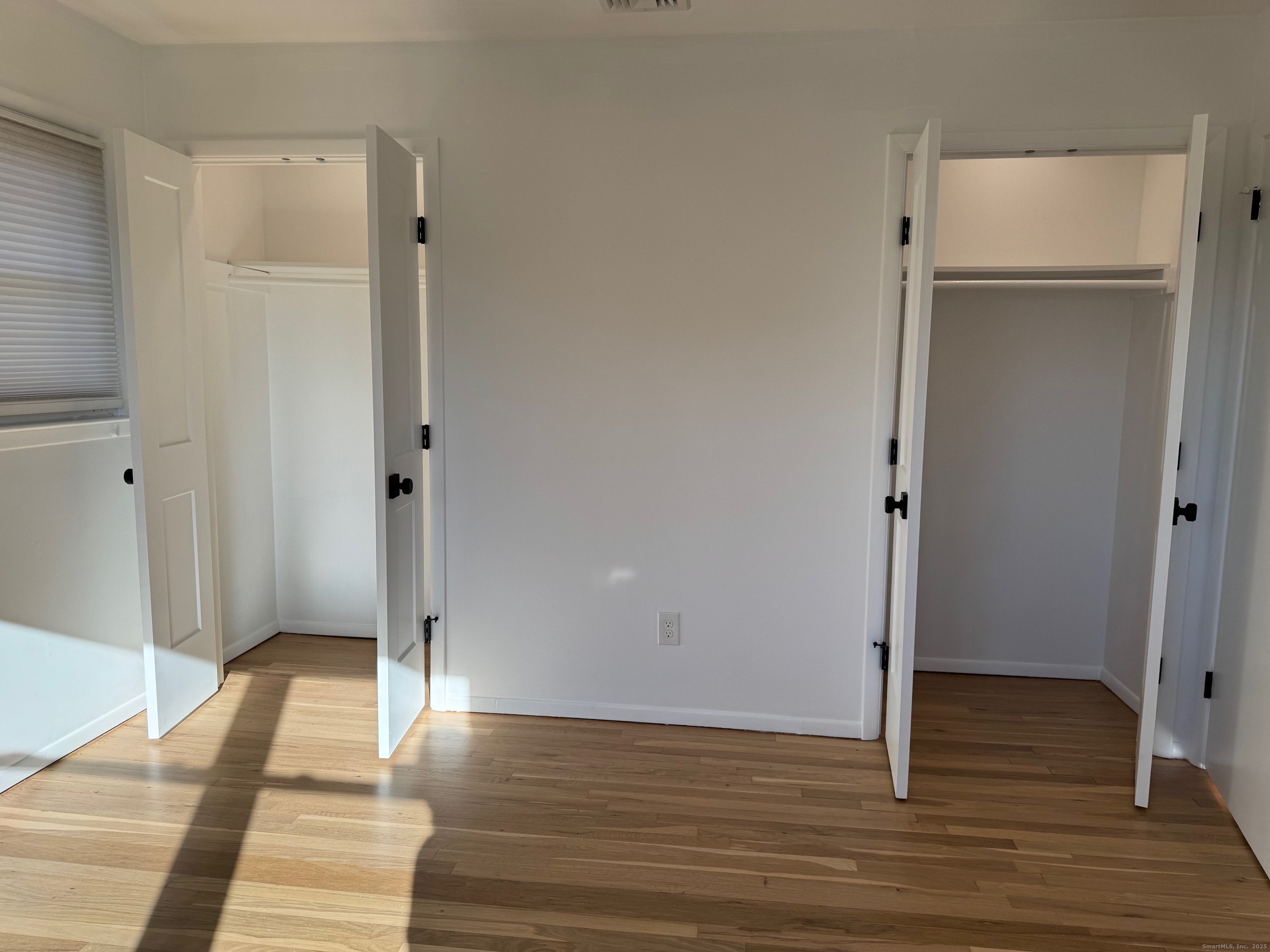 15 Sunwich Road Norwalk, CT 06853 - Photo 19 of 33 a view of a room with wooden floor