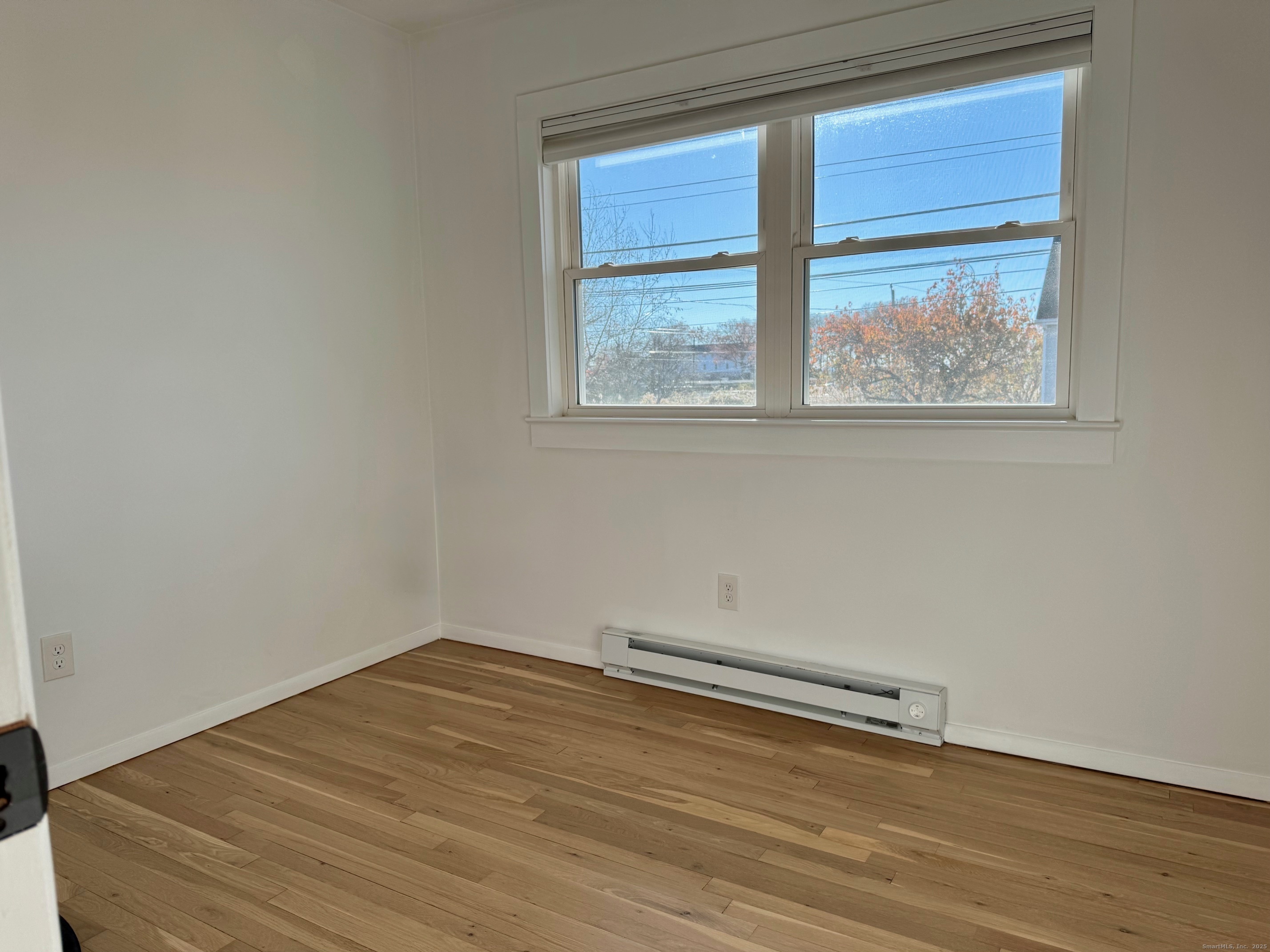 15 Sunwich Road Norwalk, CT 06853 - Photo 20 of 33 a view of a room with wooden floor and window