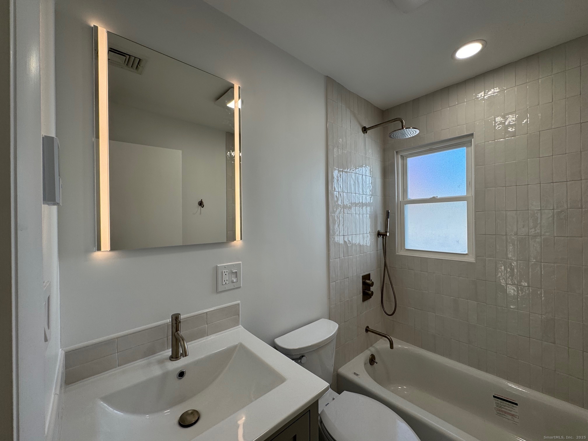 15 Sunwich Road Norwalk, CT 06853 - Photo 23 of 33 a bathroom with a sink mirror toilet and bathtub