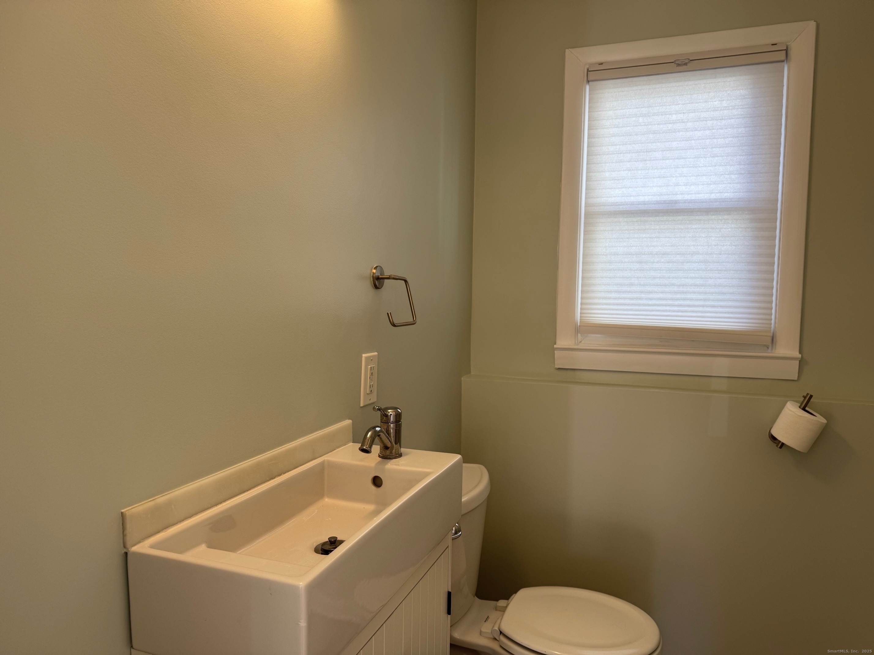 15 Sunwich Road Norwalk, CT 06853 - Photo 27 of 33 a bathroom with a sink and a toilet