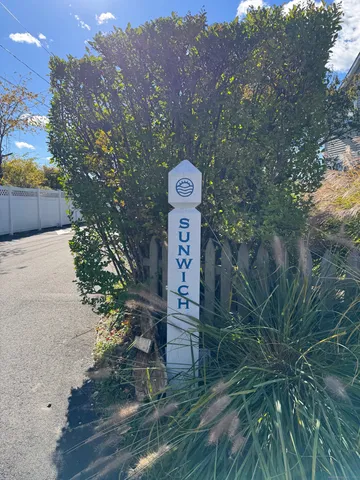 a picture of a tree in front of a house