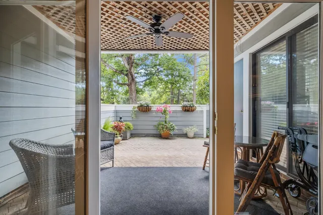 a patio with table and chairs