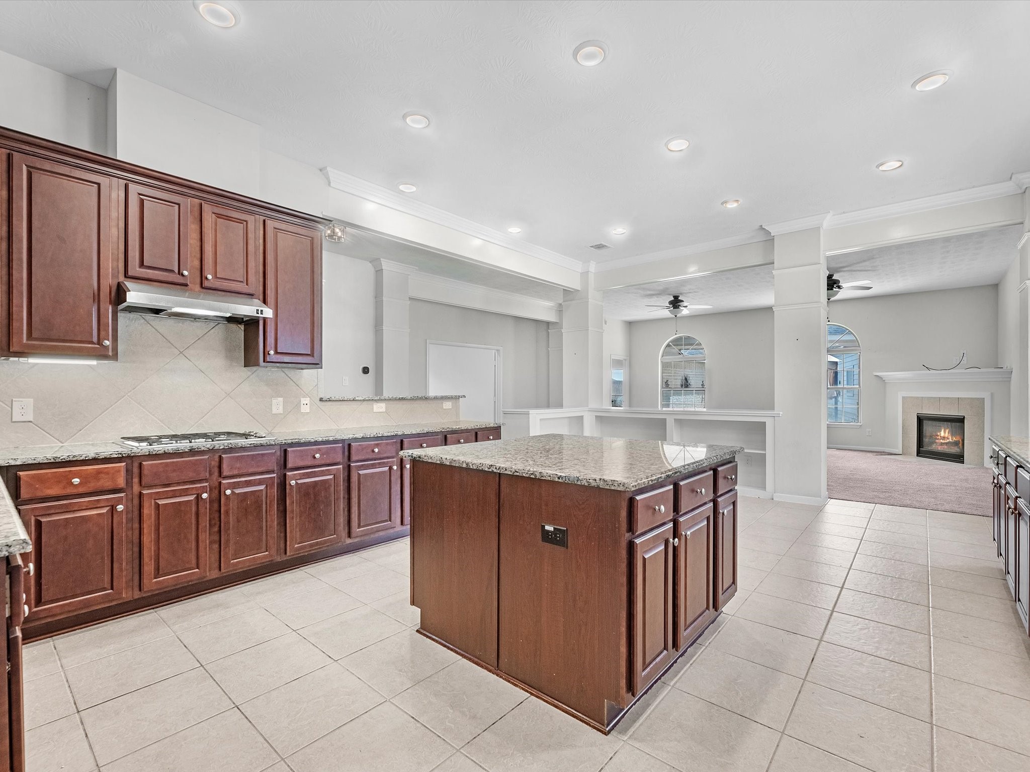 38 Palmero Way Manvel, TX 77578 - Photo 16 of 43 a kitchen with granite countertop a sink and cabinets