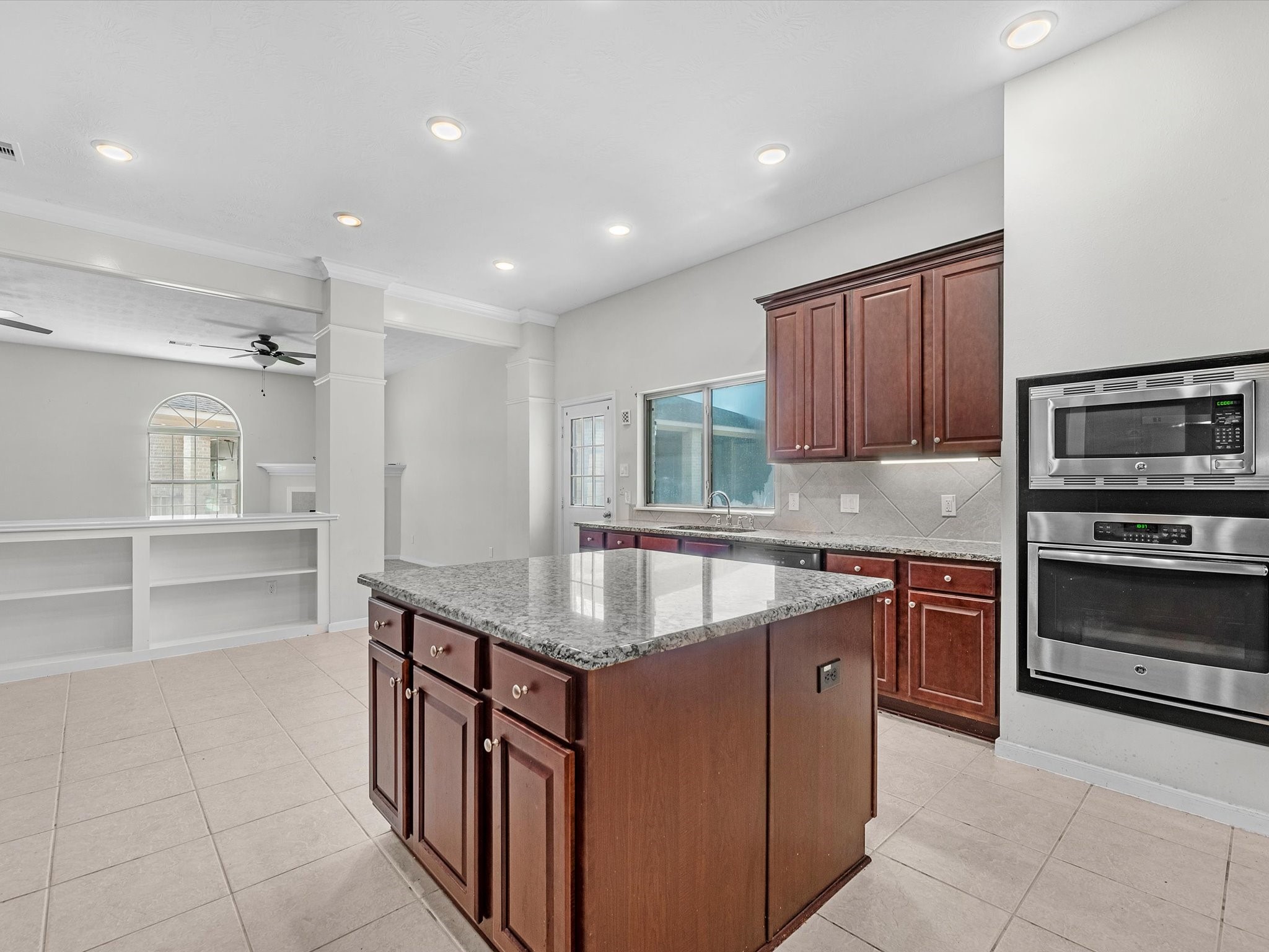 38 Palmero Way Manvel, TX 77578 - Photo 17 of 43 a kitchen with stainless steel appliances granite countertop a sink counter space and cabinets
