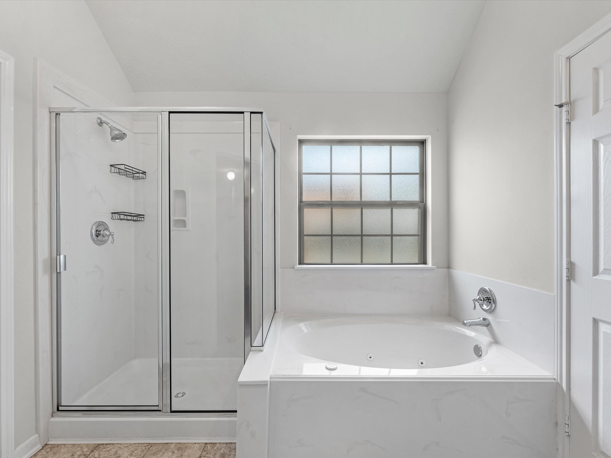 38 Palmero Way Manvel, TX 77578 - Photo 25 of 43 a bathroom with a bathtub and shower
