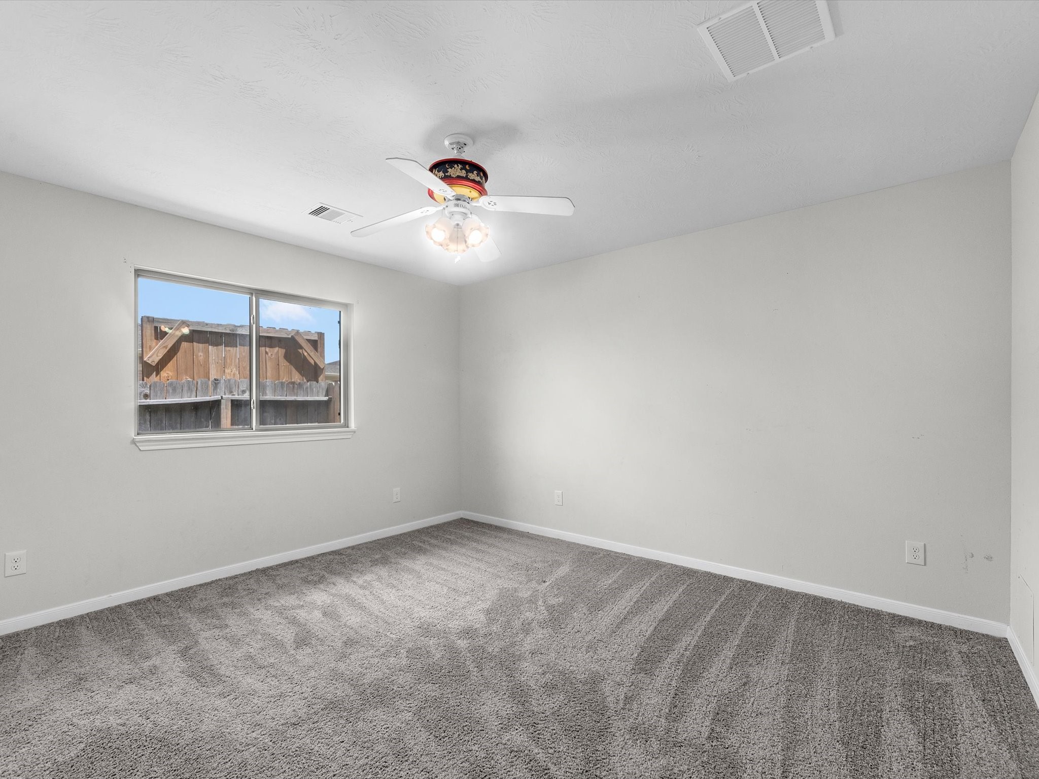 38 Palmero Way Manvel, TX 77578 - Photo 29 of 43 a view of an empty room with a window