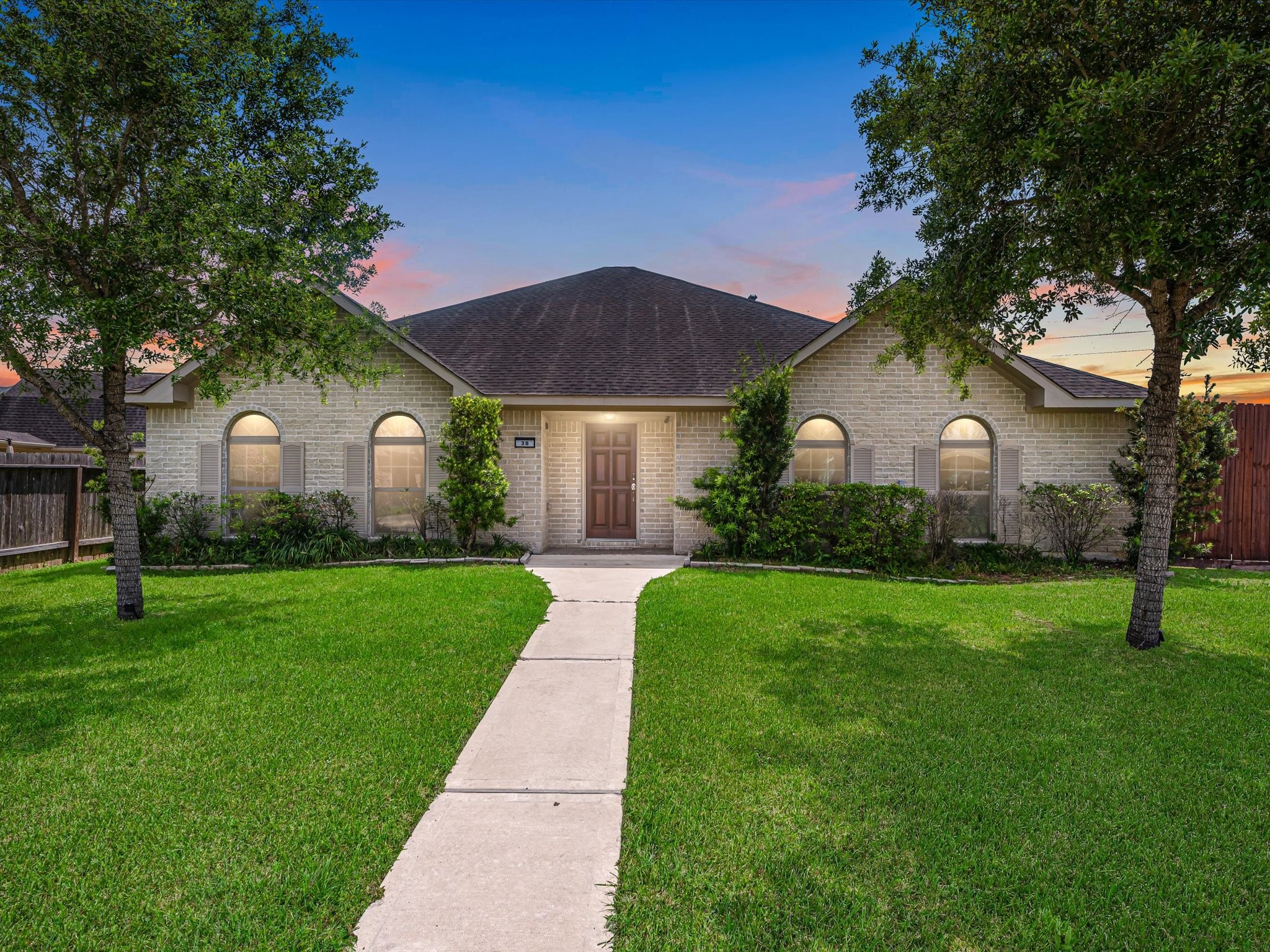 38 Palmero Way Manvel, TX 77578 - Photo 3 of 43 a front view of a house with a yard and trees