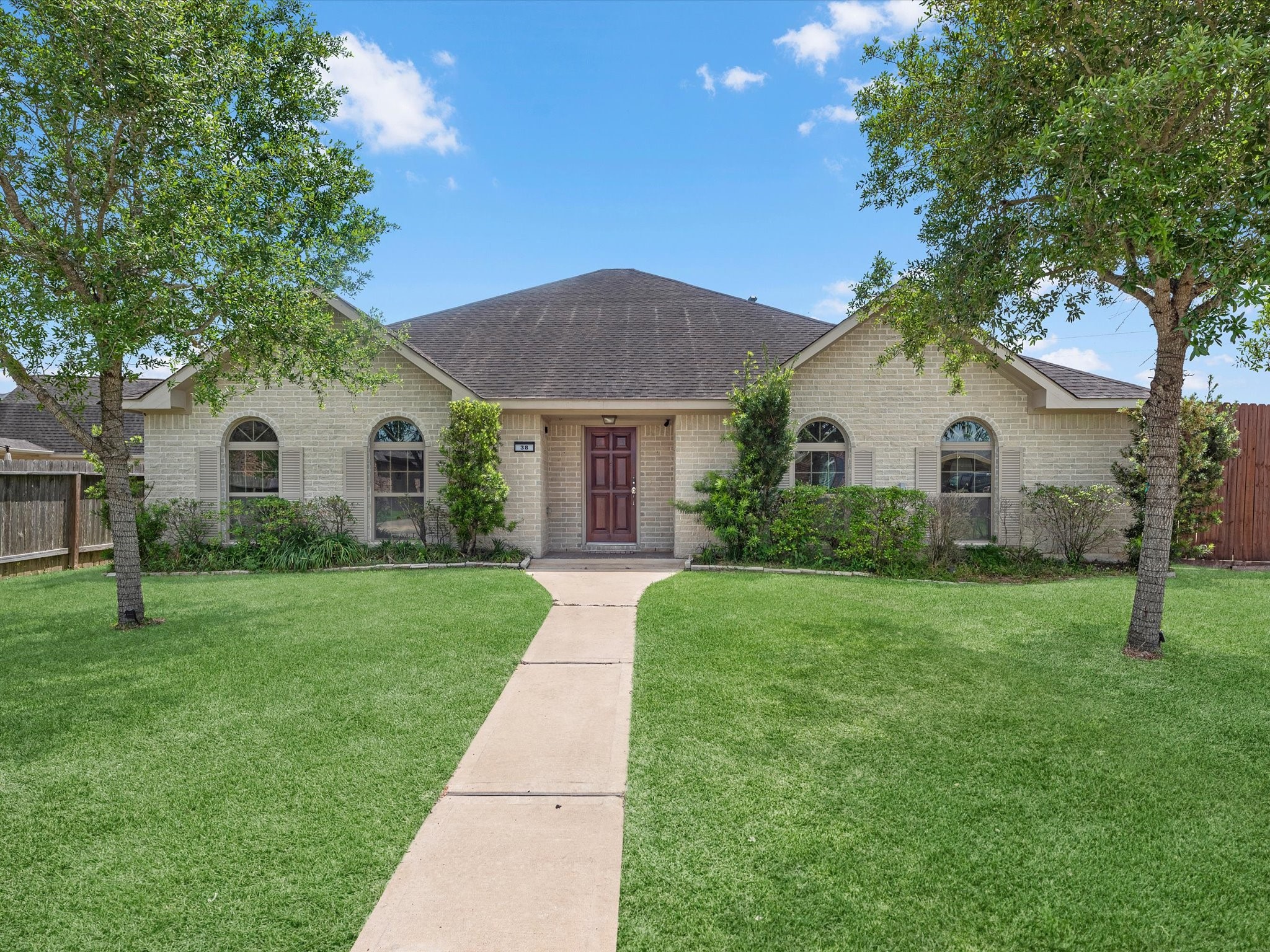 38 Palmero Way Manvel, TX 77578 - Photo 4 of 43 a view of a white house with a yard