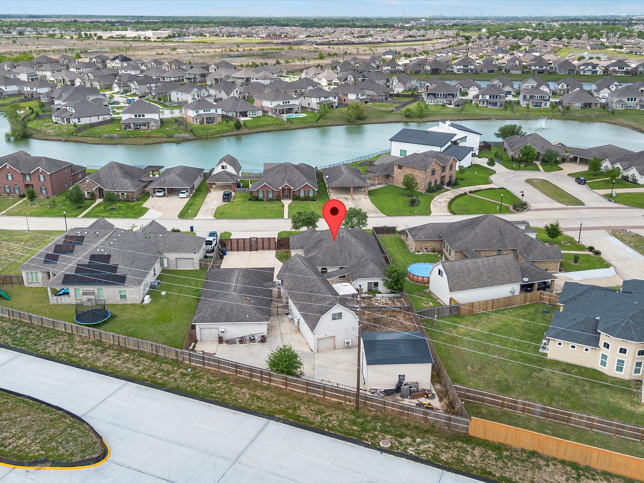 38 Palmero Way Manvel, TX 77578 - Photo 41 of 43 an aerial view of residential houses with outdoor space and lake view