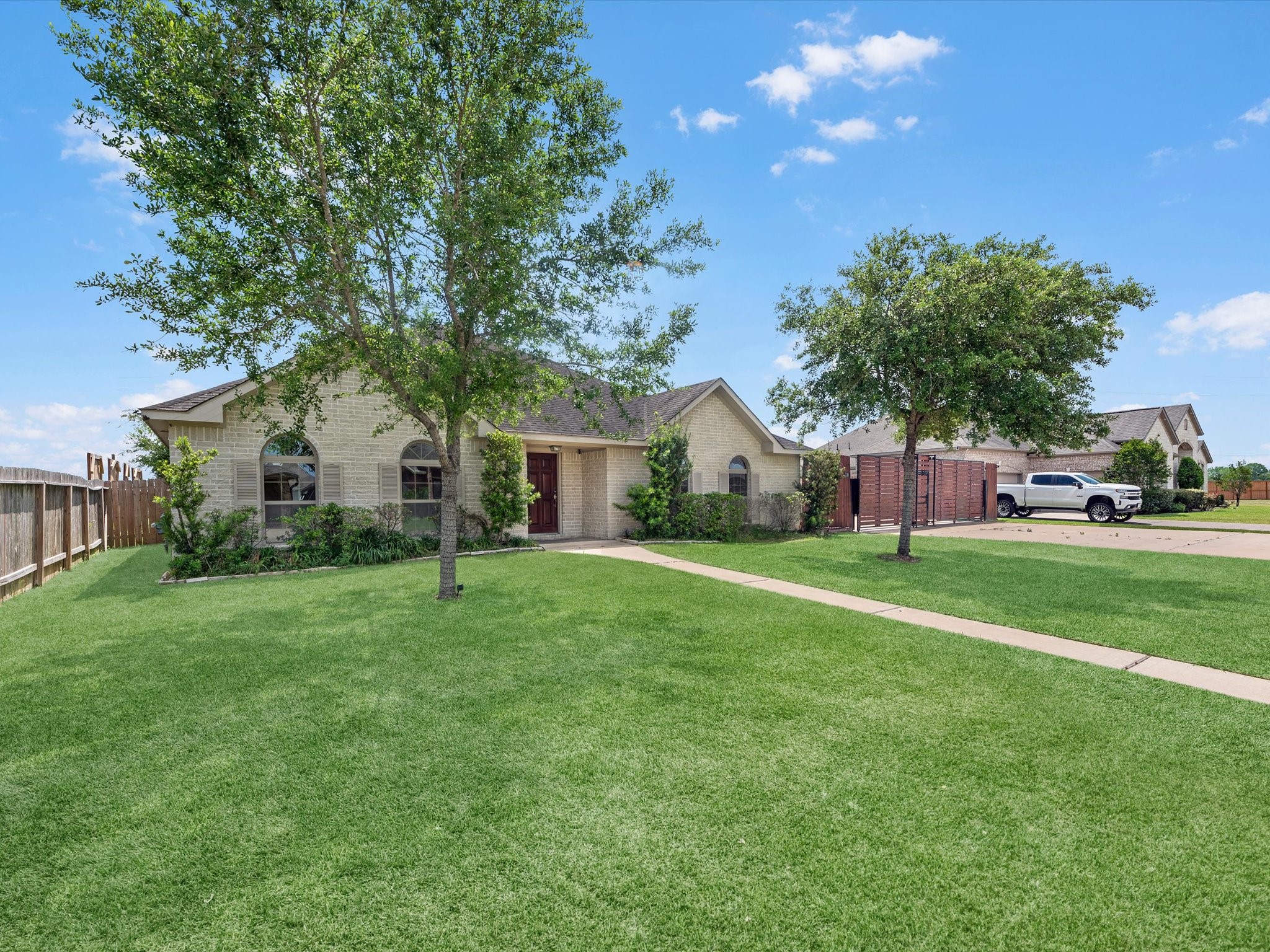 38 Palmero Way Manvel, TX 77578 - Photo 5 of 43 a front view of a house with a yard and trees