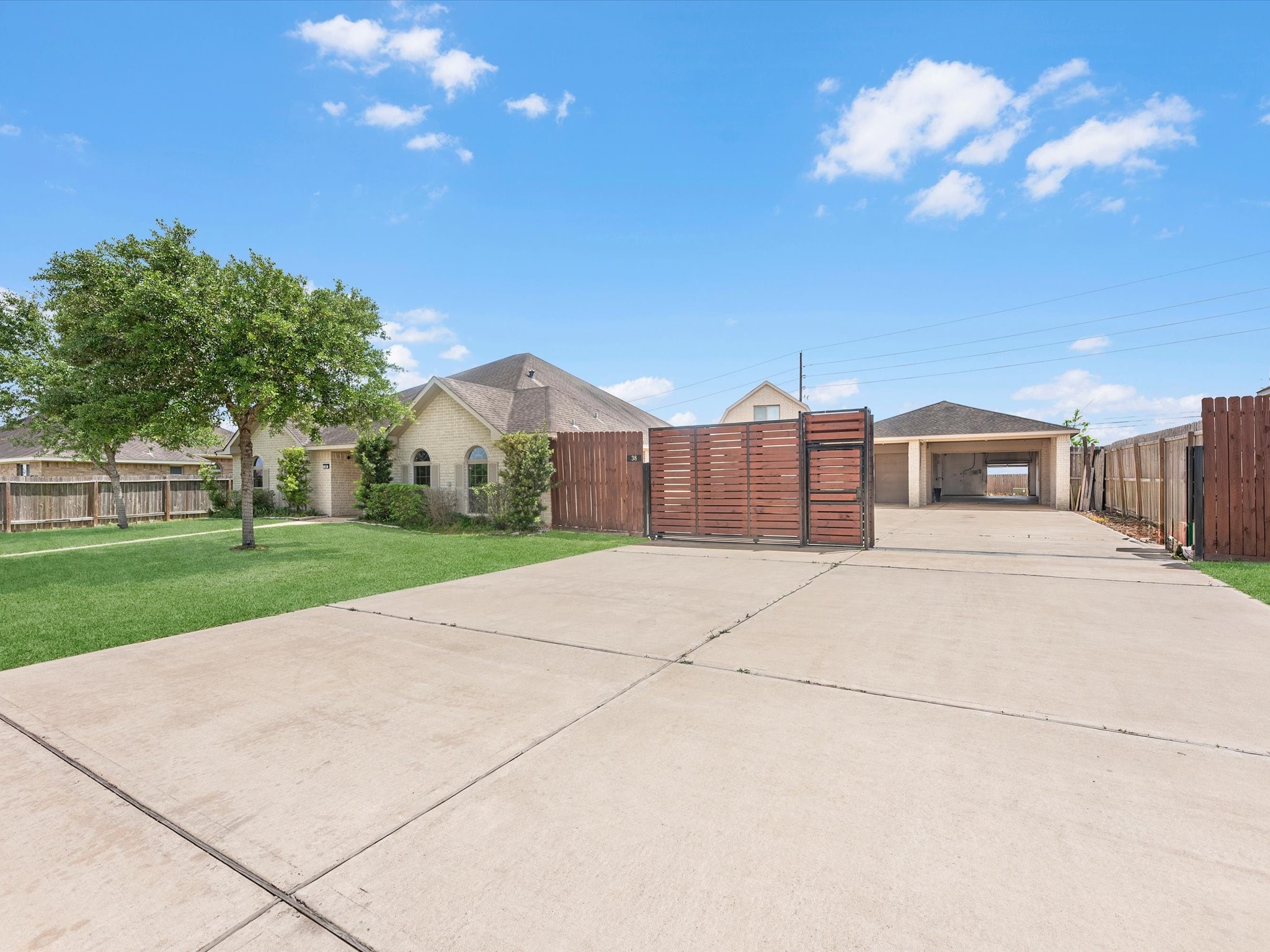 38 Palmero Way Manvel, TX 77578 - Photo 7 of 43 a front view of a house with a yard and garage