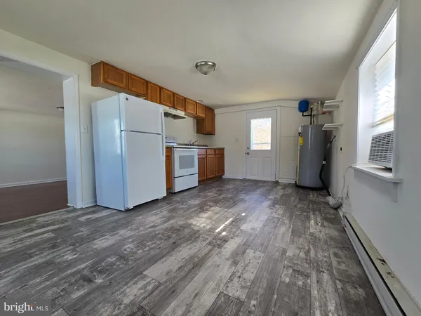 a view of a storage & utility room with closet window