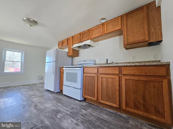 a view of a kitchen with cabinets