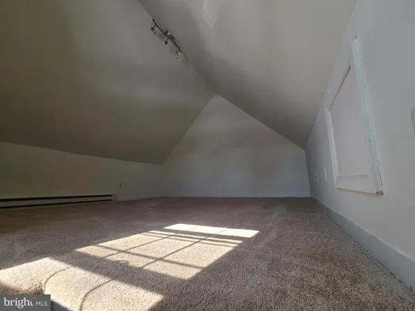 a view of room with racks on the wall