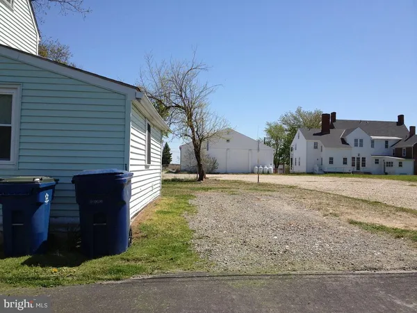 a view of a swimming pool with a yard