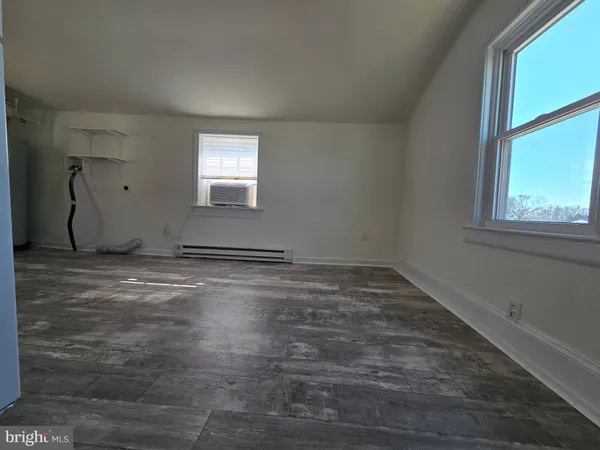 a view of empty room with windows