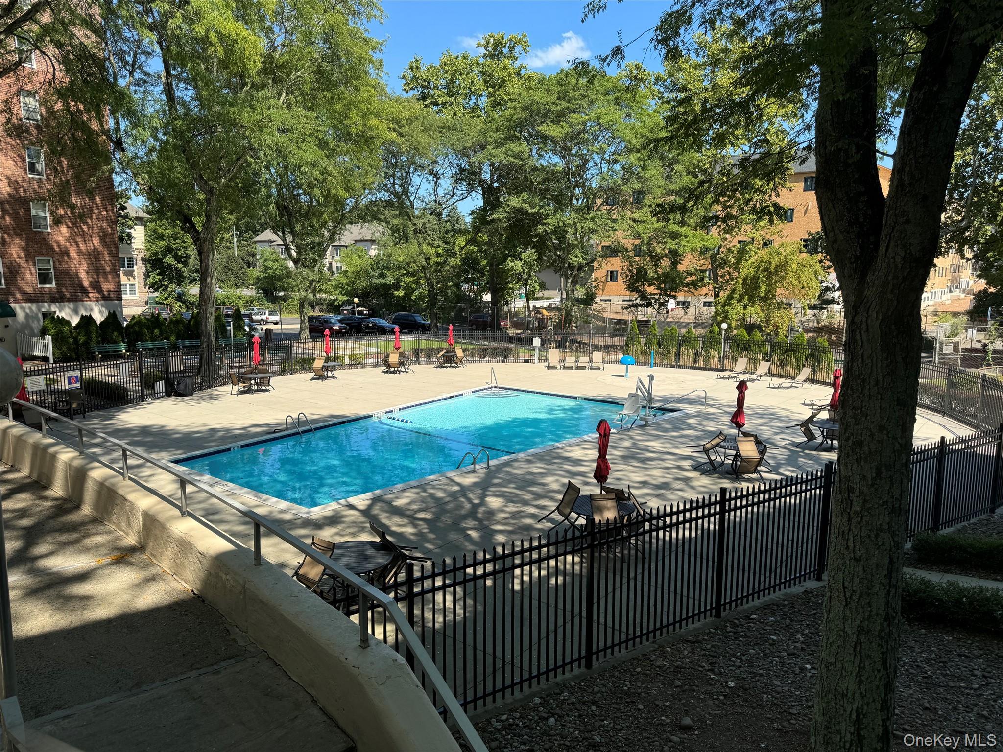 30 South Cole Avenue, Unit 1L Spring Valley, NY 10977 - Photo 29 of 29 a view of a backyard and swimming pool
