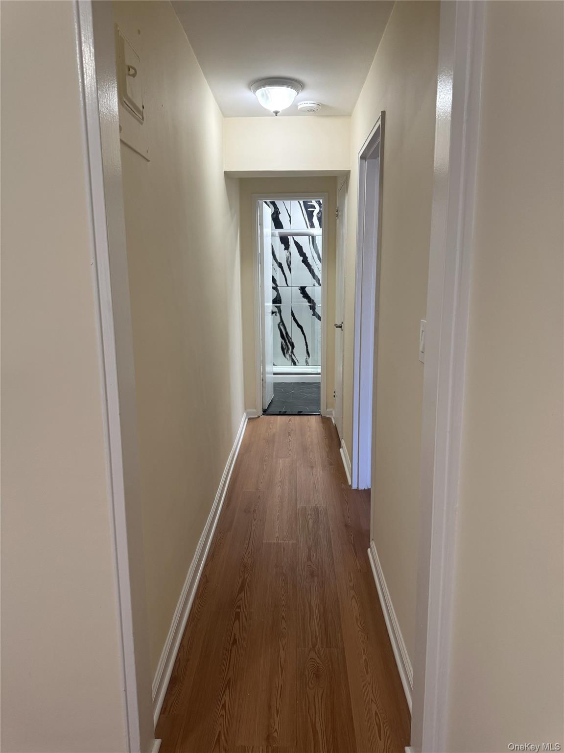 30 South Cole Avenue, Unit 1L Spring Valley, NY 10977 - Photo 8 of 29 a view of a hallway with wooden floor