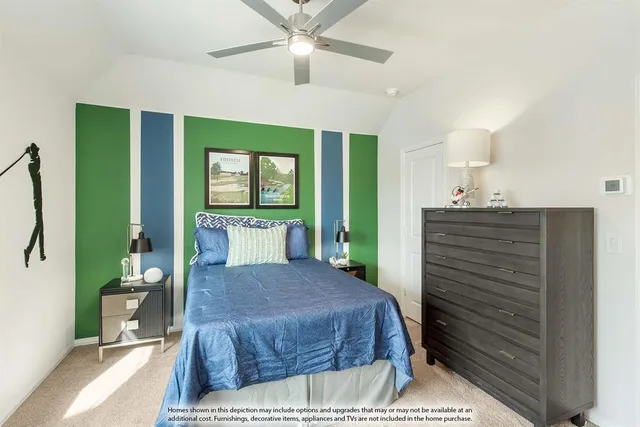 a bedroom with a large bed couch and a window