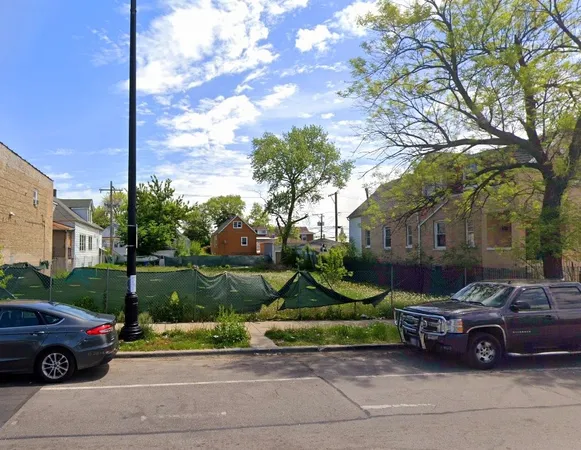 a front view of a house with a garden and parking space