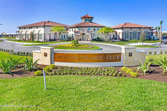 a front view of a building with garden