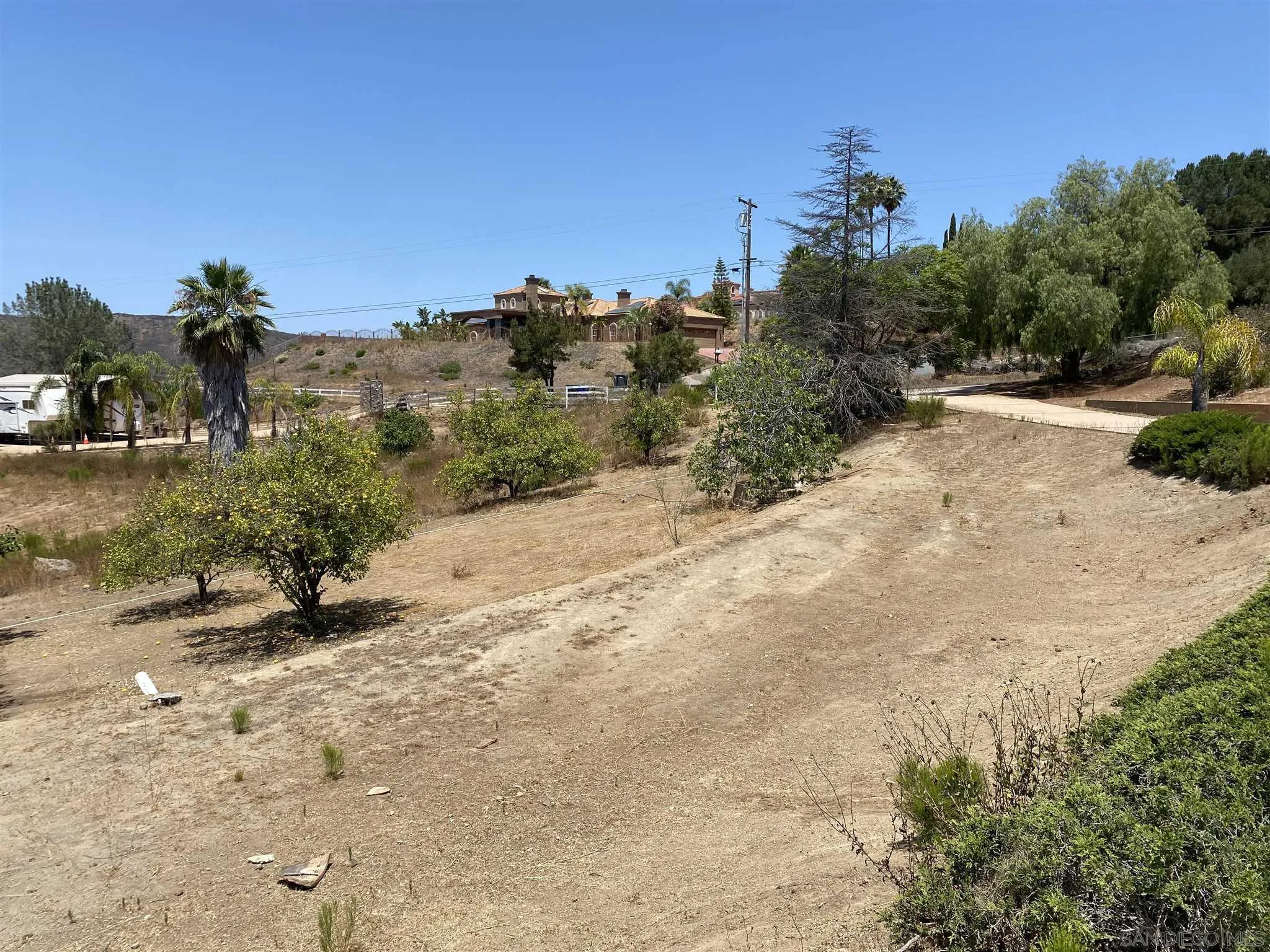 14605 Alkosh Road Jamul, CA 91935 - Photo 18 of 22 a view of a road with a building in the background