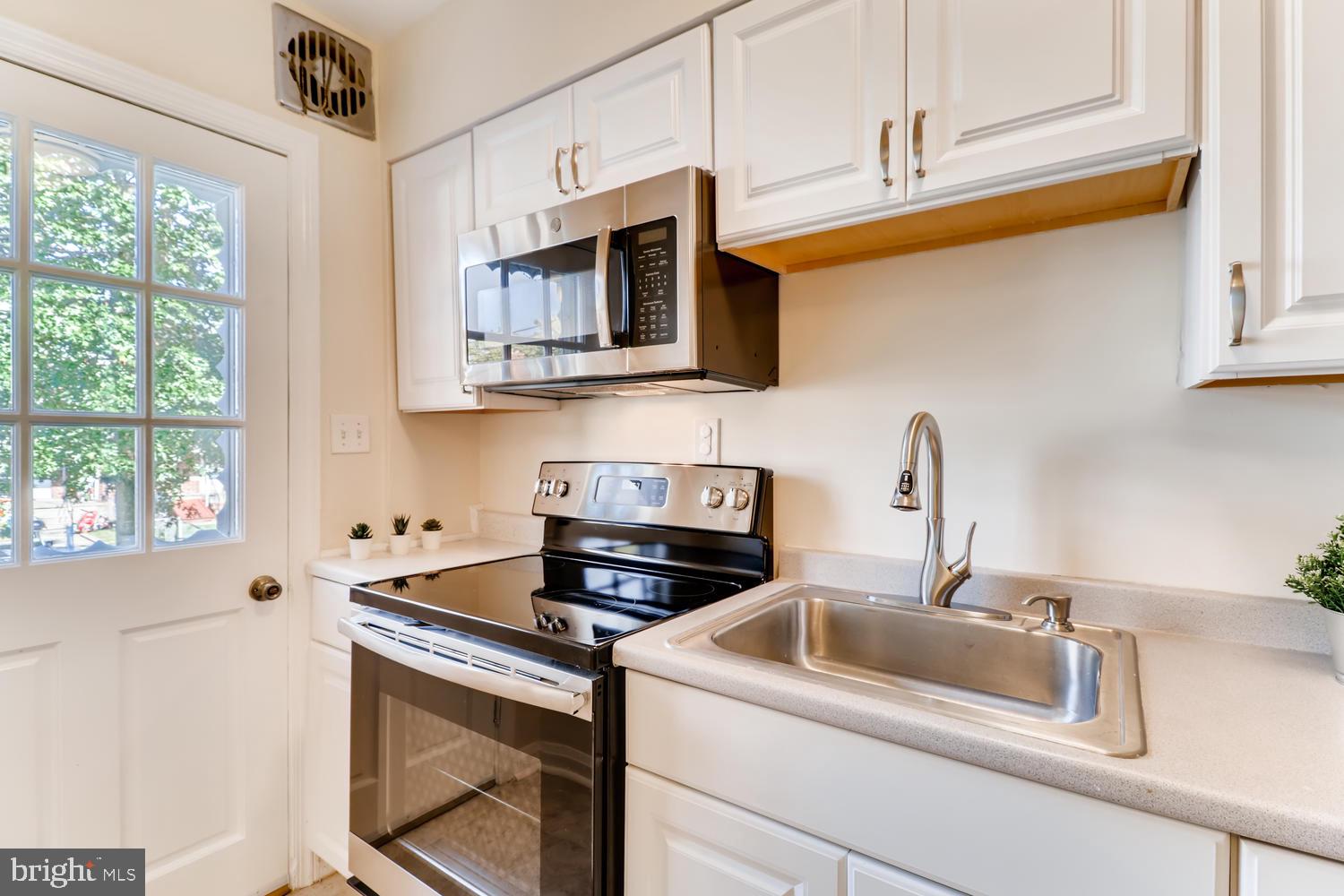 8342 Ridgely Oak Road Parkville, MD 21234 - Photo 14 of 31 Stainless microwave and range