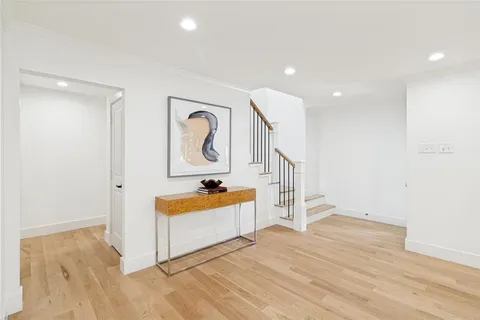 a view of room with wooden floor