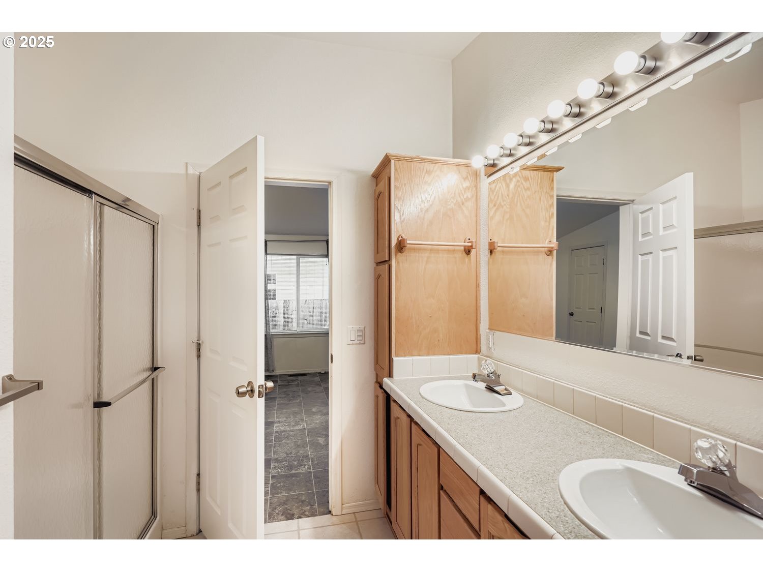 2111 Pippin Street Northeast Salem, OR 97305 - Photo 13 of 26 a bathroom with a sink double vanity and a mirror
