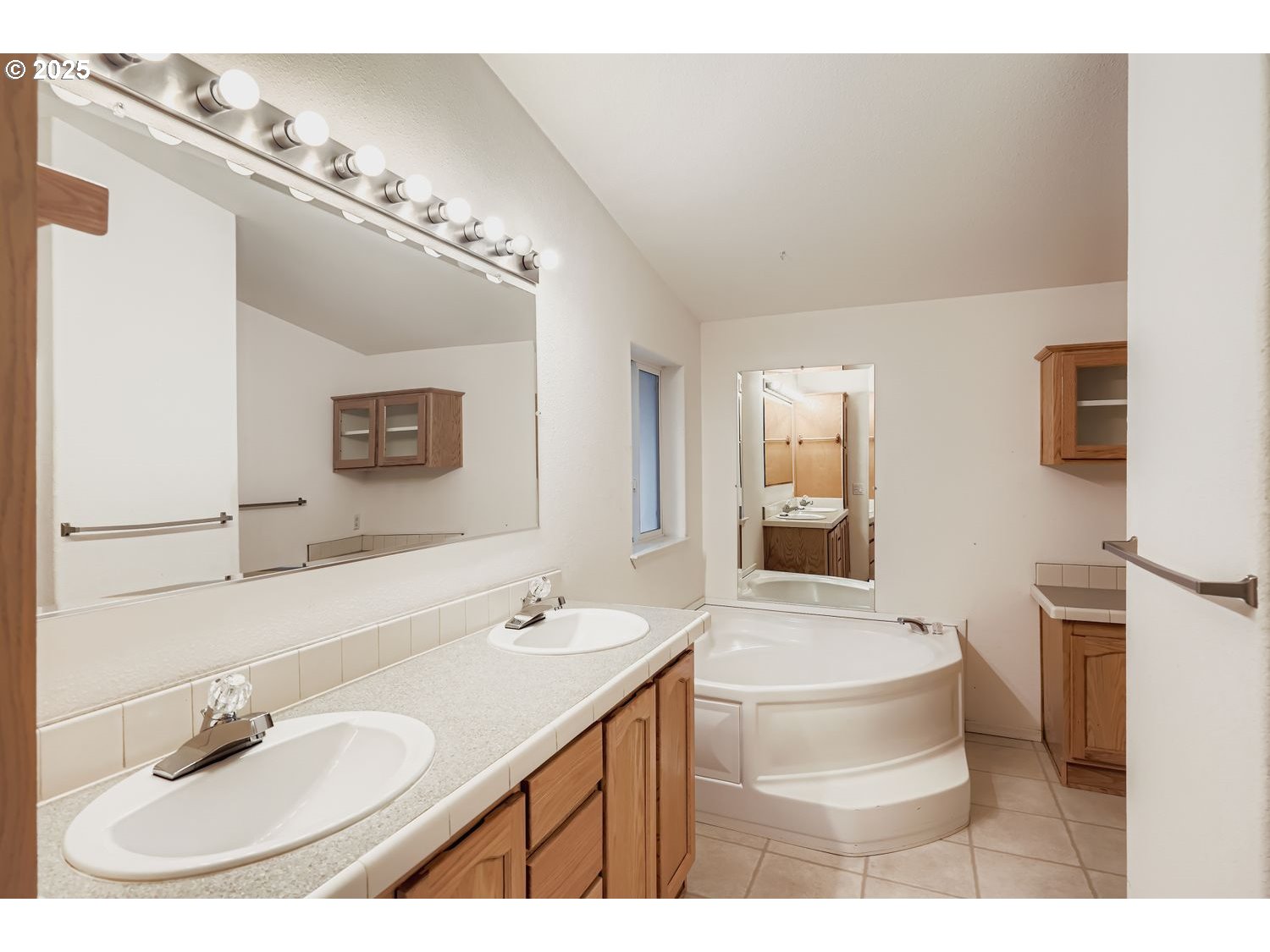 2111 Pippin Street Northeast Salem, OR 97305 - Photo 14 of 26 a bathroom with a sink double vanity and a mirror
