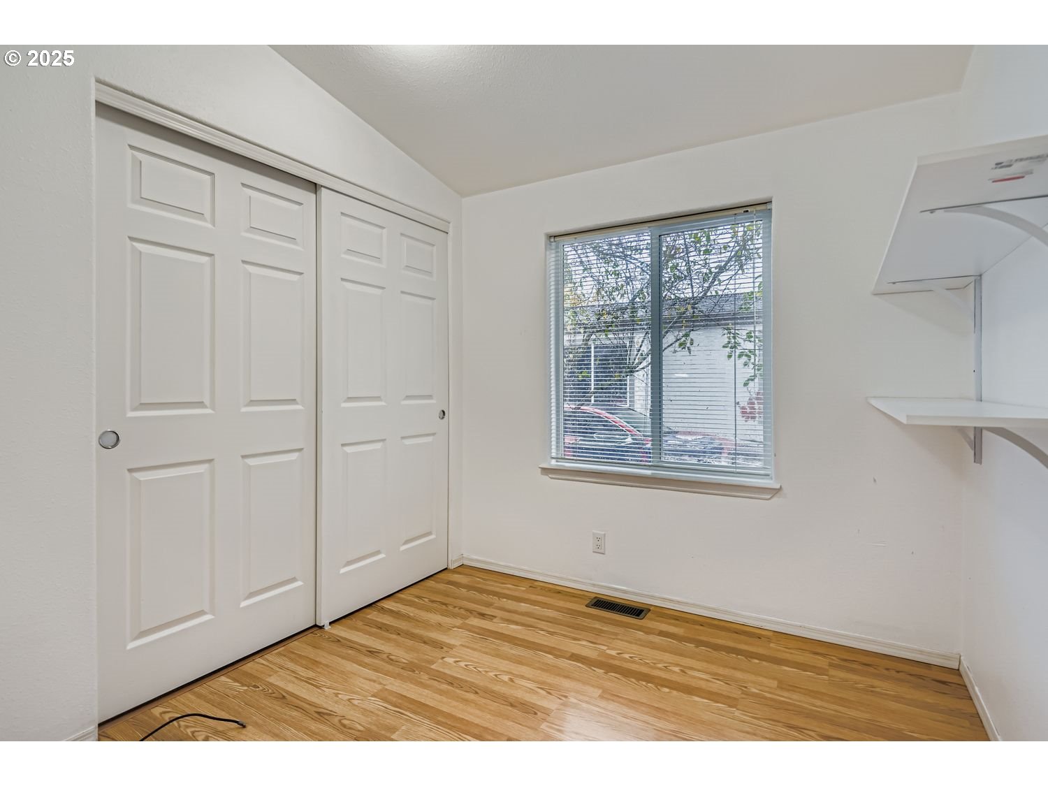 2111 Pippin Street Northeast Salem, OR 97305 - Photo 15 of 26 a view of an empty room with wooden floor and a window