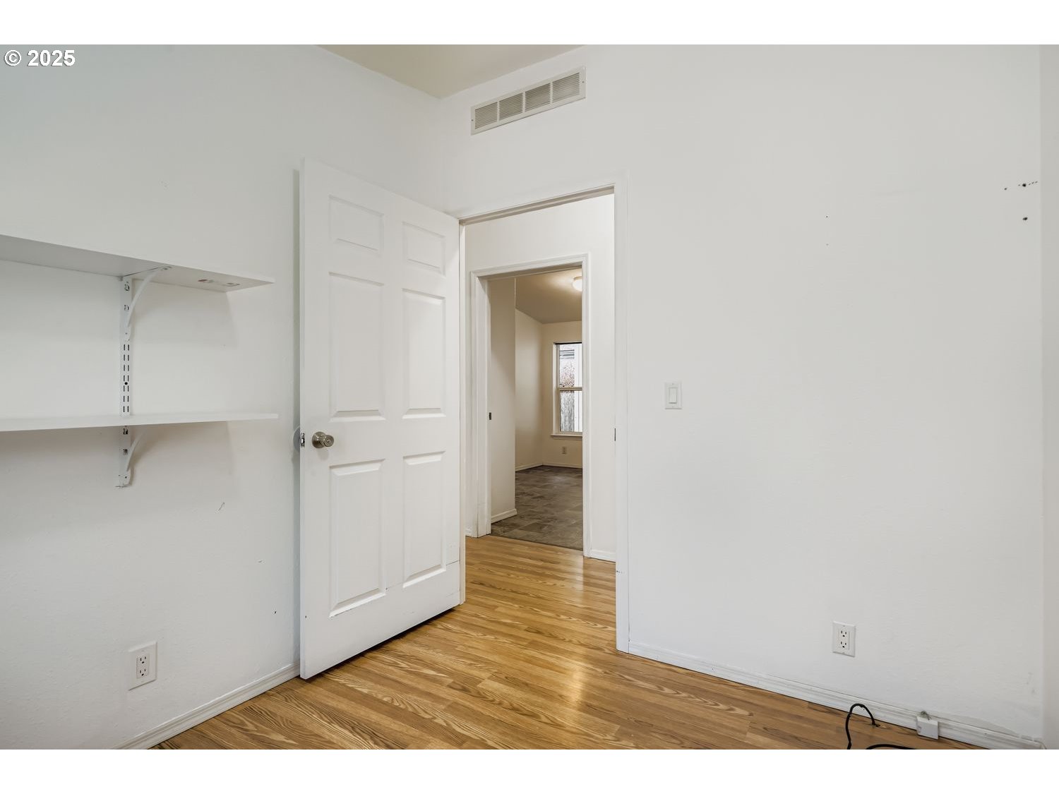 2111 Pippin Street Northeast Salem, OR 97305 - Photo 16 of 26 a view of an empty room with wooden floor