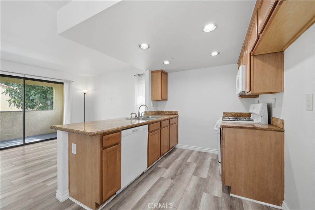 1142 West Blaine Street Riverside, CA 92507 - Photo 8 of 33 Kitchen offers upgraded cabinetry and granite countertops.