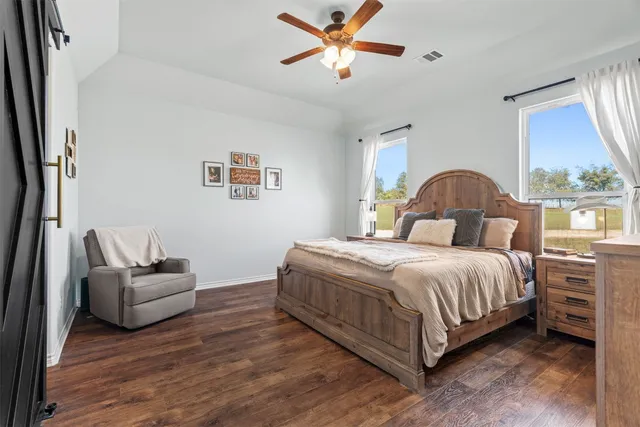 a bedroom with a bed and window