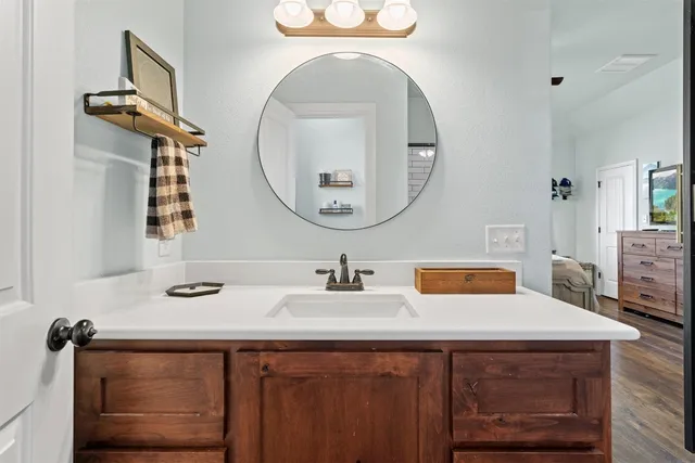 a bathroom with a sink and a mirror