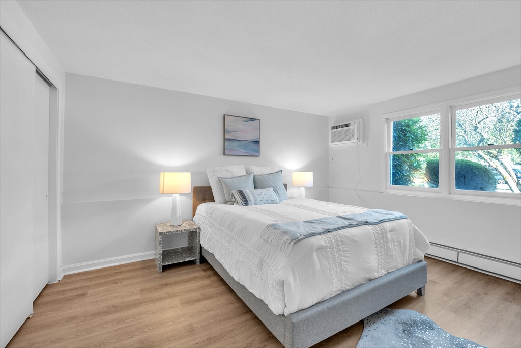 25 Pine Street, Unit B Canton, MA 02021 - Photo 16 of 23 a bedroom with a bed and window