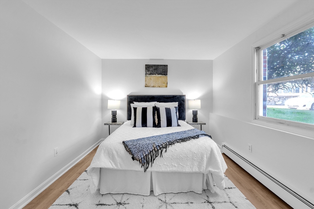 25 Pine Street, Unit B Canton, MA 02021 - Photo 19 of 23 a bedroom with a bed and window