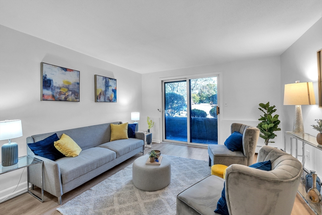 25 Pine Street, Unit B Canton, MA 02021 - Photo 3 of 23 a living room with furniture and a wooden floor