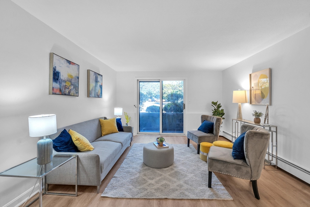 25 Pine Street, Unit B Canton, MA 02021 - Photo 4 of 23 a living room with furniture rug and window