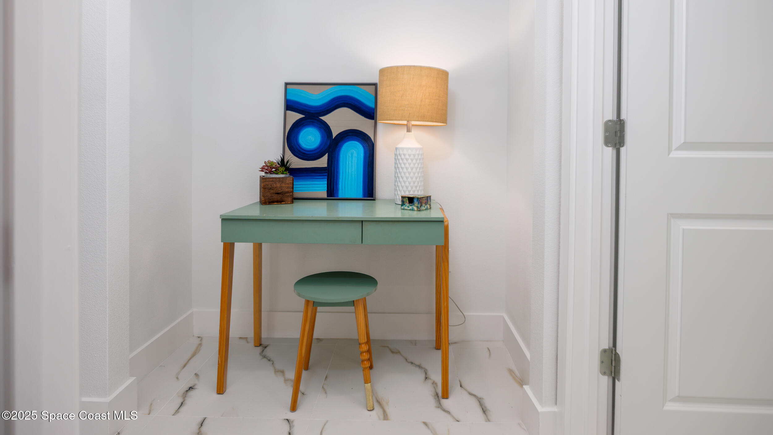 702 Shady Lane Melbourne, FL 32935 - Photo 14 of 14 a table room with a table and a chandelier