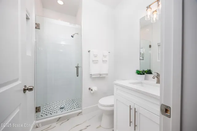 a bedroom with a bed and a chair