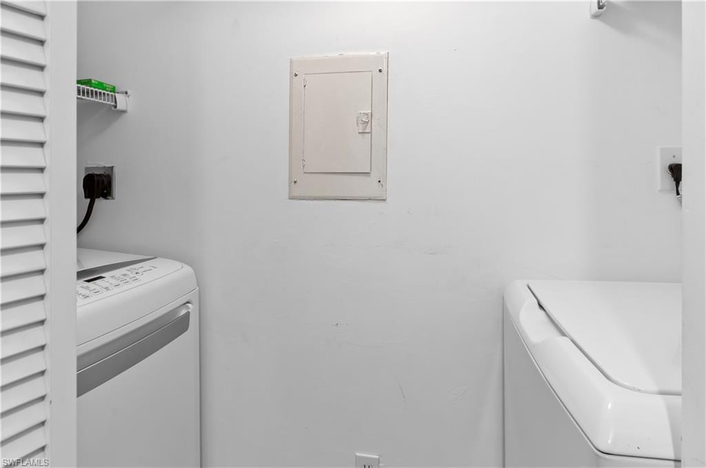 29 High Point Circle East, Unit 106 Naples, FL 34103 - Photo 19 of 42 a utility room with dryer and washer