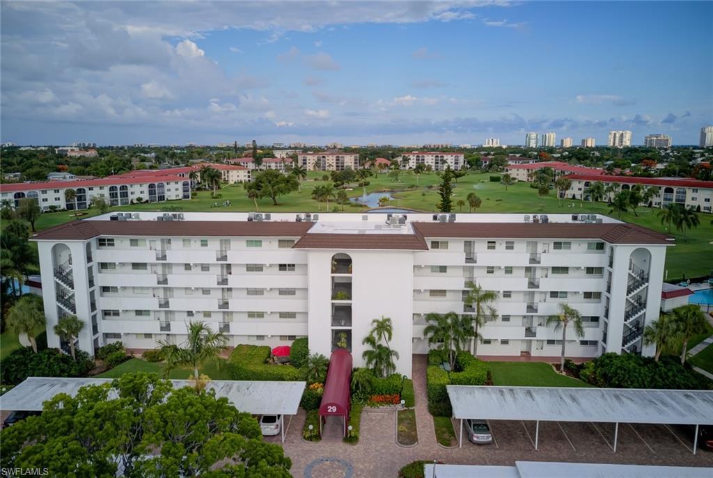 29 High Point Circle East, Unit 106 Naples, FL 34103 - Photo 27 of 42 a view of a city with tall buildings