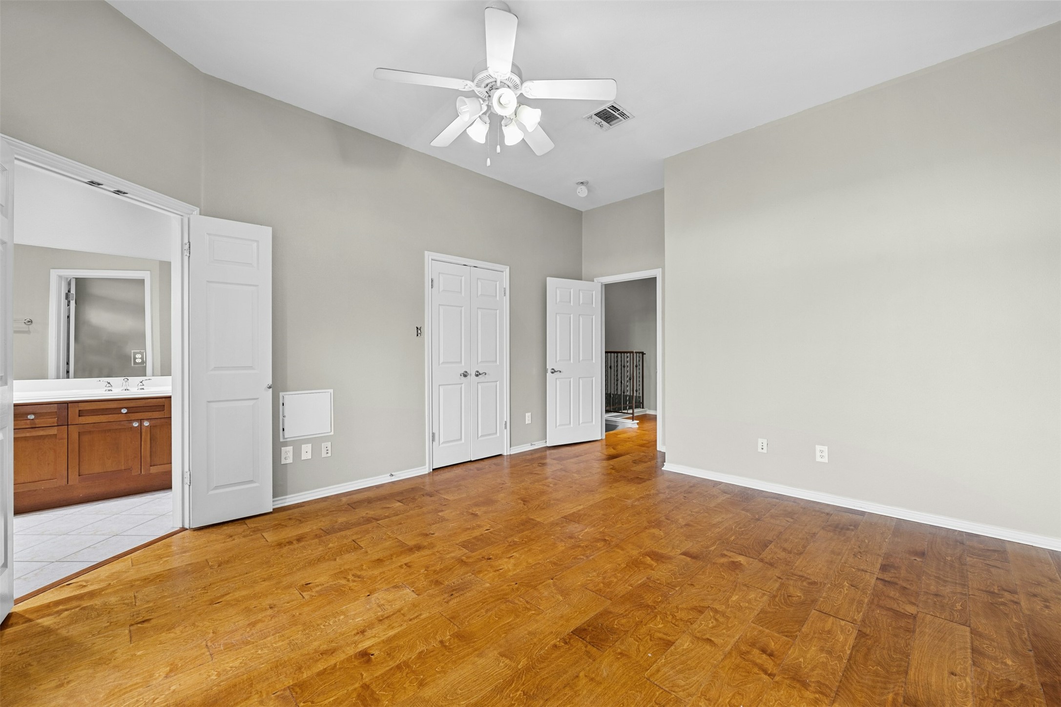 2918 Ranch To Market Road 620, Unit W219 Austin, TX 78734 - Photo 21 of 35 Enjoy vaulted ceilings, abundant natural light, and direct balcony access from the oversized primary bedroom.