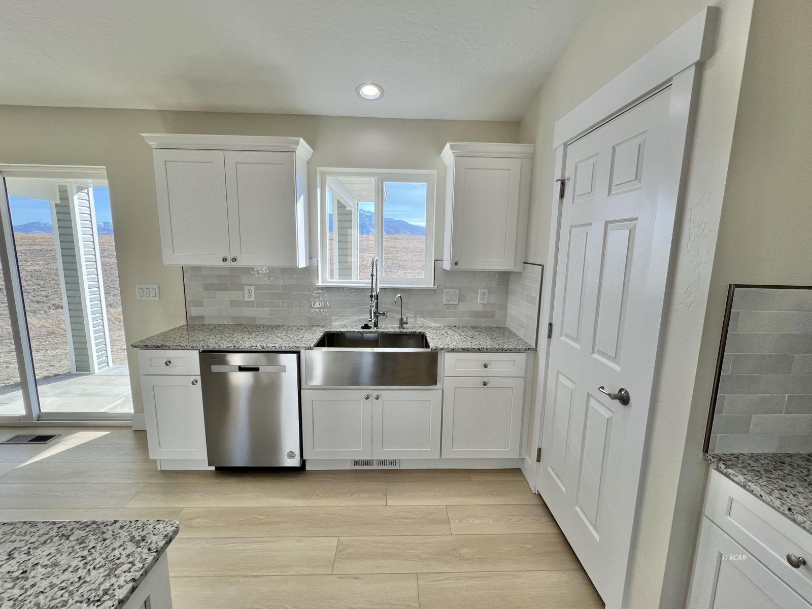 1096 Sun Vly Road Spring Creek, NV 89815 - Photo 6 of 31 a kitchen with stainless steel appliances granite countertop a stove a sink and a refrigerator