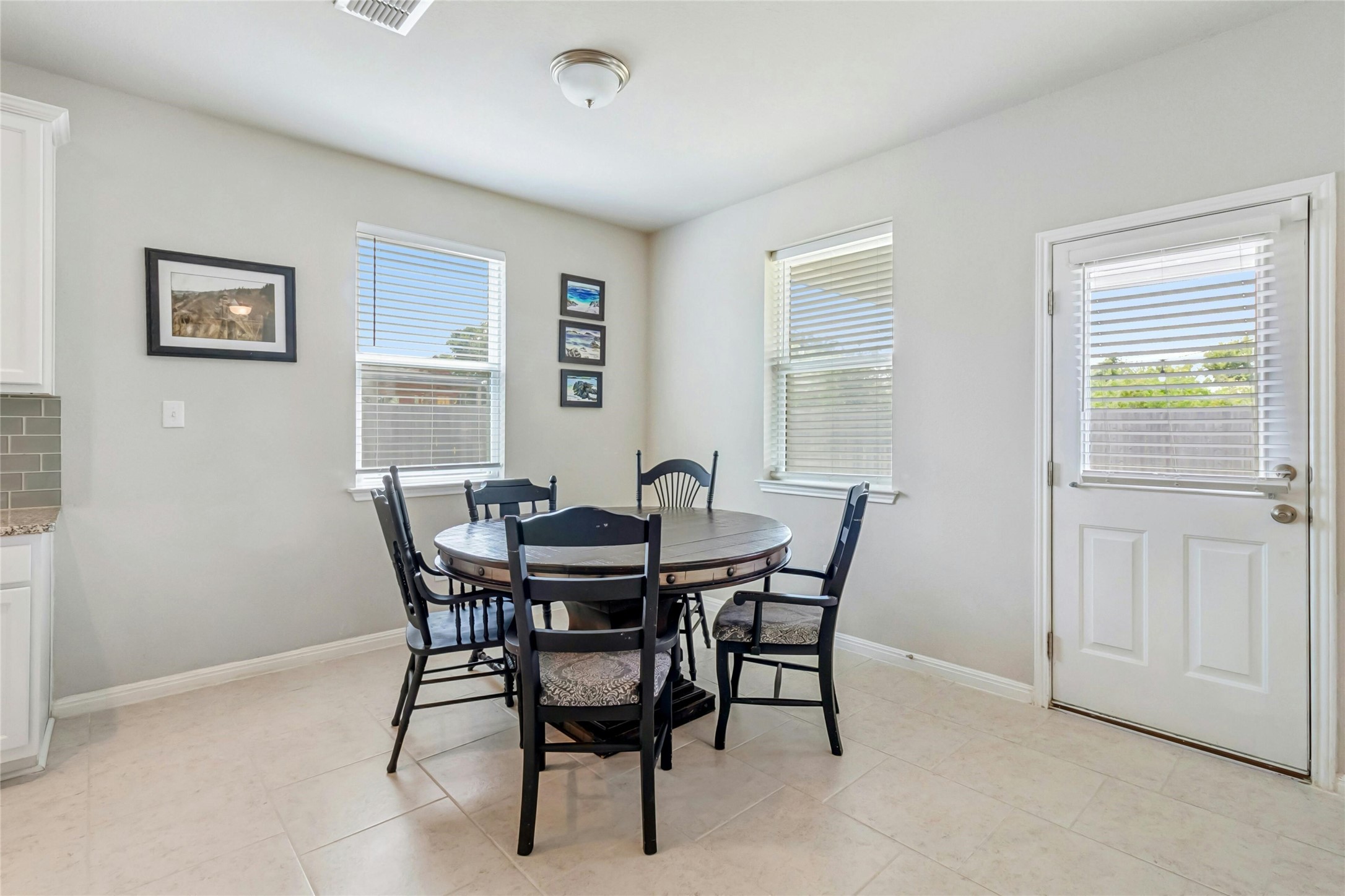 112 Silver Spgs Bend Kyle, TX 78640 - Photo 14 of 33 Dining area easily seats 6 - 8, and can accommodate a round or oblong table for a full house!