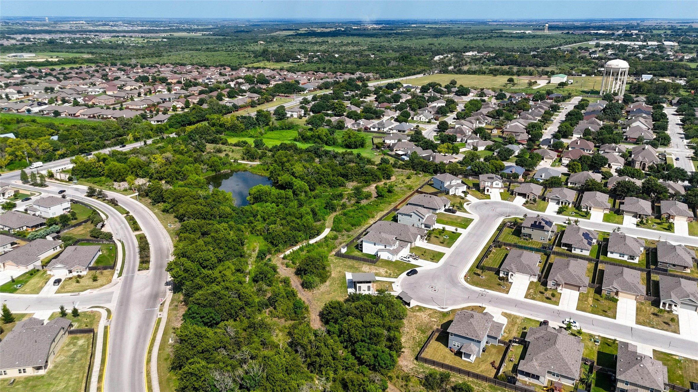 112 Silver Spgs Bend Kyle, TX 78640 - Photo 18 of 33 Expansive lot as viewed from the aerial view. Home is to the bottom right of the photo, next to the bend and bordered by grove of trees to the east and north. (The view from your bedroom!)
